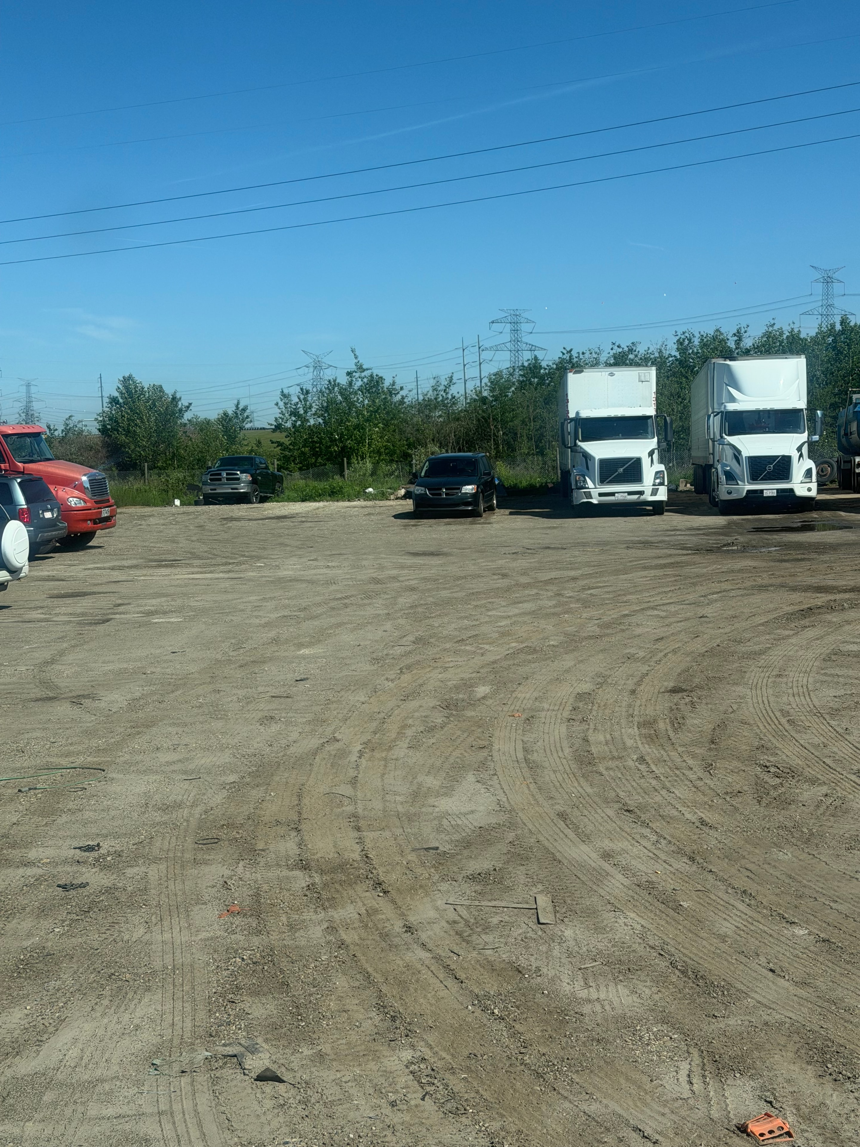 Trucks and trailers parked at Ladhar Trucking Edmonton yard facility